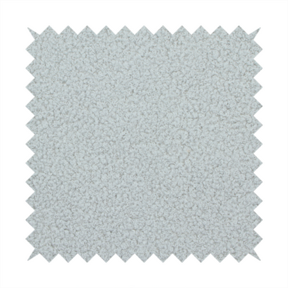 A light grey or pale ice-blue boucle fabric texture.