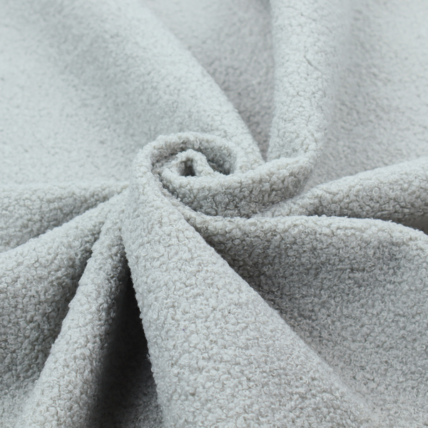 A light grey or pale ice-blue boucle fabric texture.