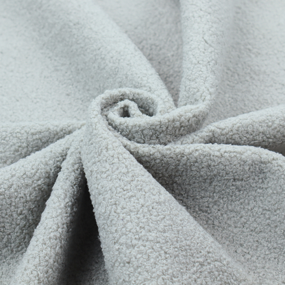 A light grey or pale ice-blue boucle fabric texture.