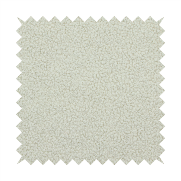 A cream or off-white boucle fabric texture.
