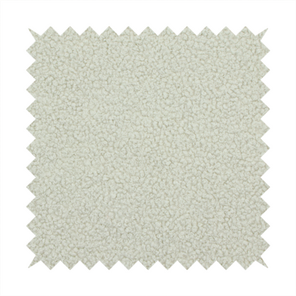 A cream or off-white boucle fabric texture.
