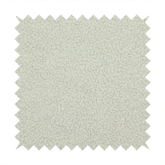 A cream or off-white boucle fabric texture.