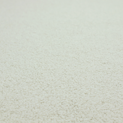 A cream or off-white boucle fabric texture.