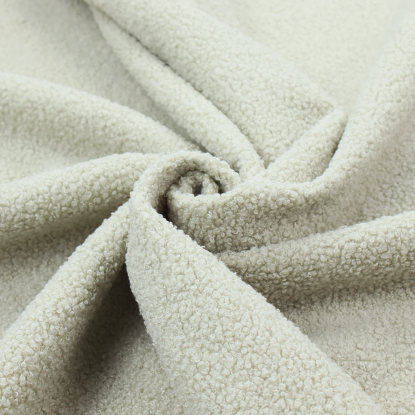 A cream or off-white boucle fabric texture.