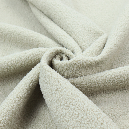 A cream or off-white boucle fabric texture.