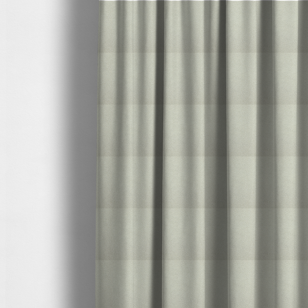 The fabric used to create these made-to-measure curtains is a cream or off-white boucle fabric texture.