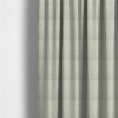 The fabric used to create these made-to-measure curtains is a cream or off-white boucle fabric texture.