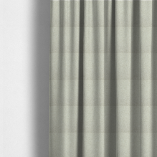 The fabric used to create these made-to-measure curtains is a cream or off-white boucle fabric texture.