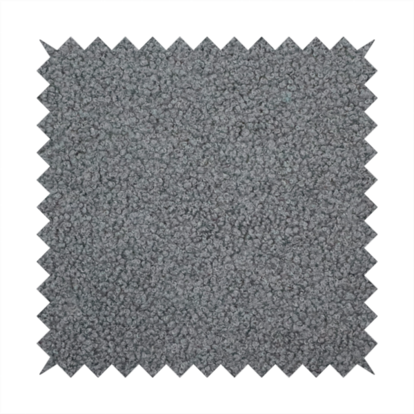 a charcoal or slate grey boucle fabric texture.
