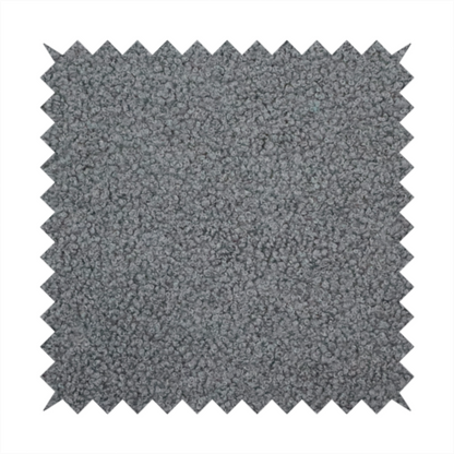 a charcoal or slate grey boucle fabric texture.