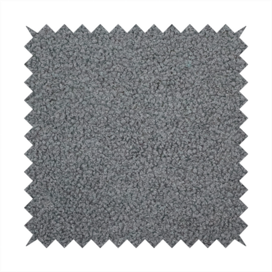 a charcoal or slate grey boucle fabric texture.