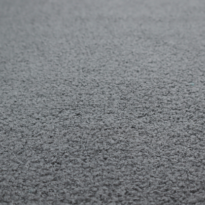 a charcoal or slate grey boucle fabric texture.