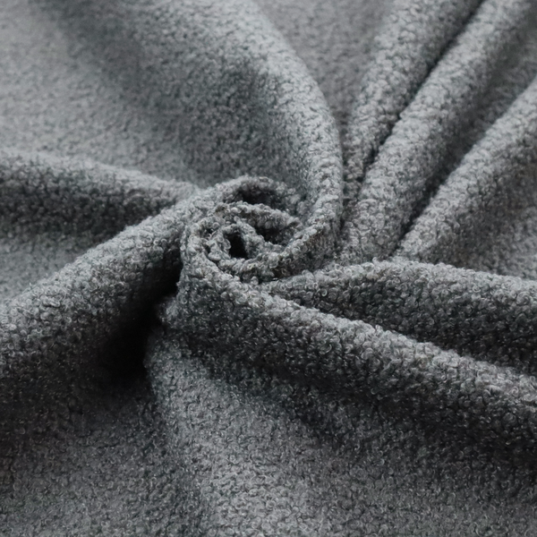 a charcoal or slate grey boucle fabric texture.