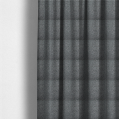The fabric used to create these made-to-measure curtains is a charcoal or slate grey boucle fabric texture.