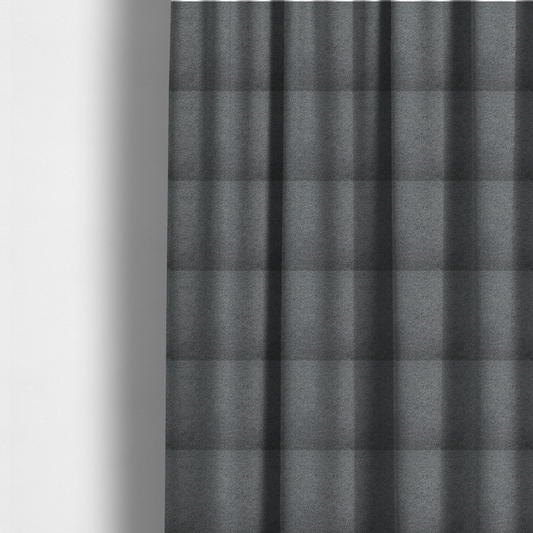 The fabric used to create these made-to-measure curtains is a charcoal or slate grey boucle fabric texture.