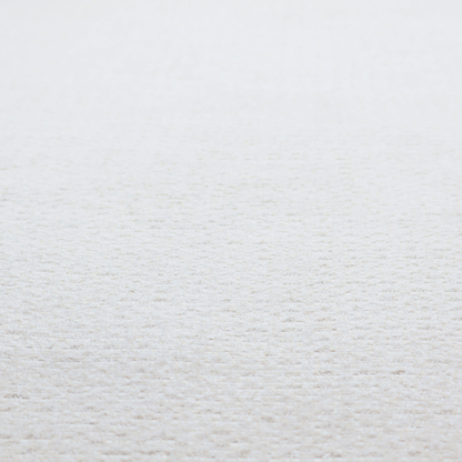 An off-white, finely textured woven upholstery fabric.