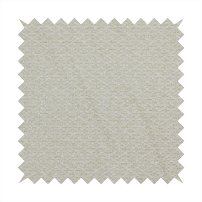A cream-coloured, textured upholstery fabric.
