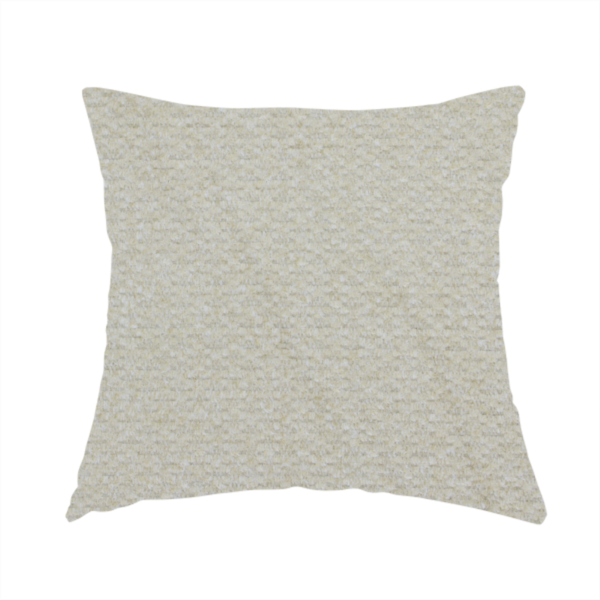 The fabric used to create this handmade cushion is a cream-coloured, textured upholstery fabric.