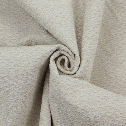A cream-coloured, textured upholstery fabric.