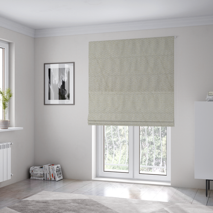The fabric used to create these Roman blinds is a cream-coloured, textured upholstery fabric.
