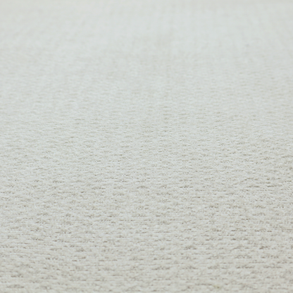 A swatch of light grey, textured upholstery fabric.