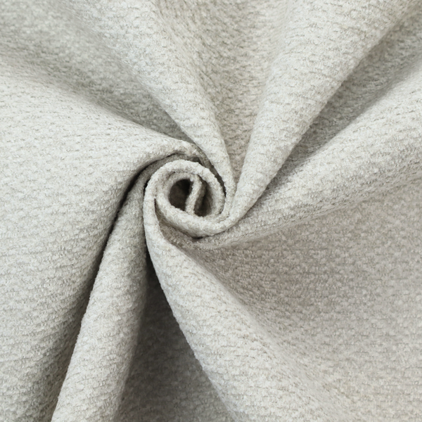 A swatch of light grey, textured upholstery fabric.