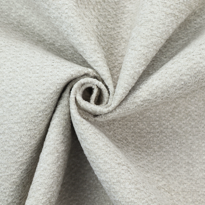A swatch of light grey, textured upholstery fabric.