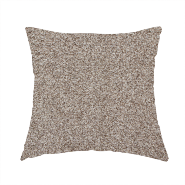 The fabric used to create this handmade cushion is a swatch of taupe, heavily textured upholstery fabric.