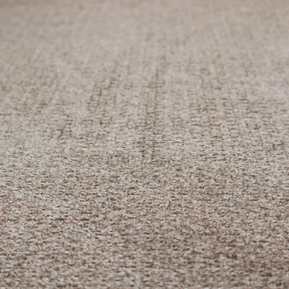 A swatch of taupe, heavily textured upholstery fabric.