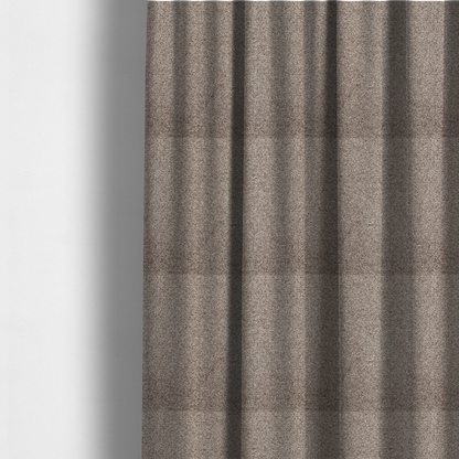 The fabric used to create these made-to-measure curtains is a swatch of taupe, heavily textured upholstery fabric.