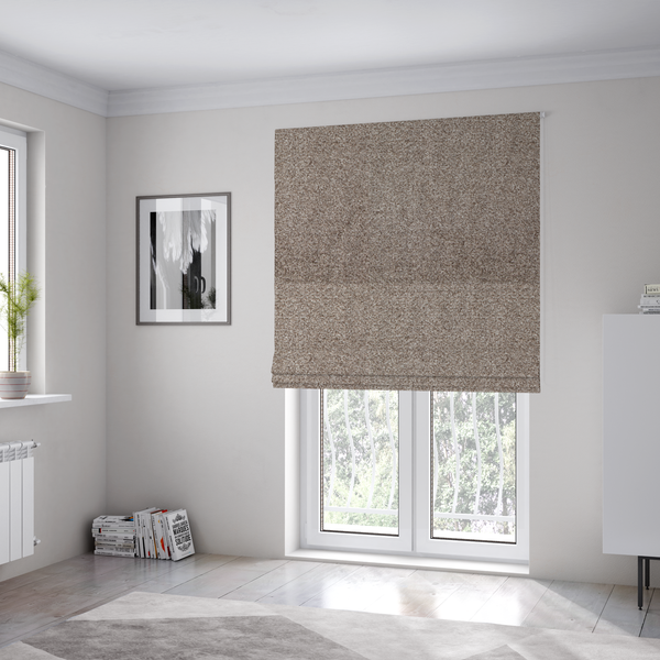 The fabric used to create these Roman blinds is a swatch of taupe, heavily textured upholstery fabric.