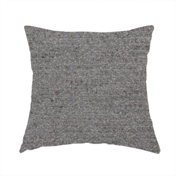 The fabric used to create this handmade cushion is a dark grey, textured upholstery fabric.