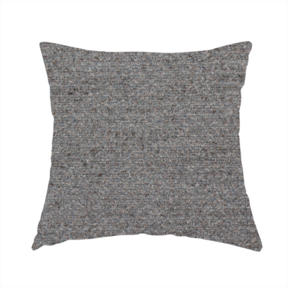 The fabric used to create this handmade cushion is a dark grey, textured upholstery fabric.