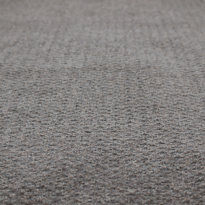 A dark grey, textured upholstery fabric.