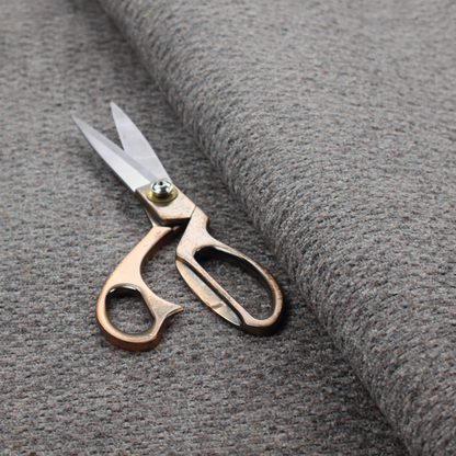 A dark grey, textured upholstery fabric.