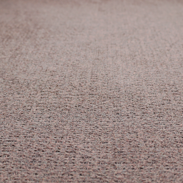 A purple textured upholstery fabric.