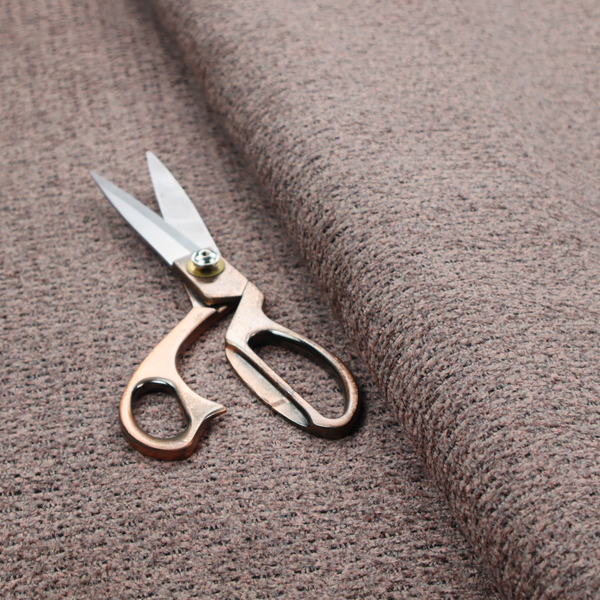 A purple textured upholstery fabric.