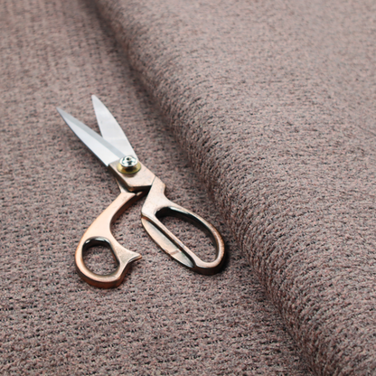 A purple textured upholstery fabric.