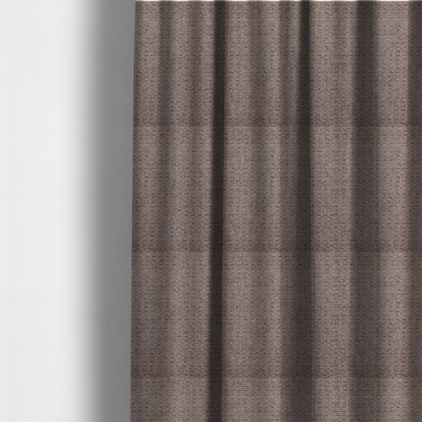 The fabric used to create these made-to-measure curtains is a purple textured upholstery fabric.