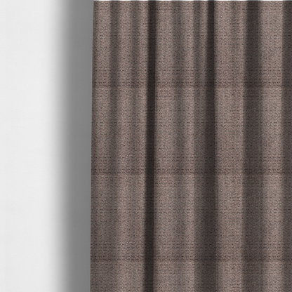 The fabric used to create these made-to-measure curtains is a purple textured upholstery fabric.