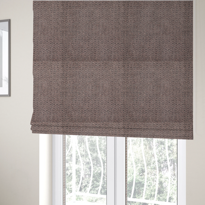 The fabric used to create these Roman blinds is a purple textured upholstery fabric.
