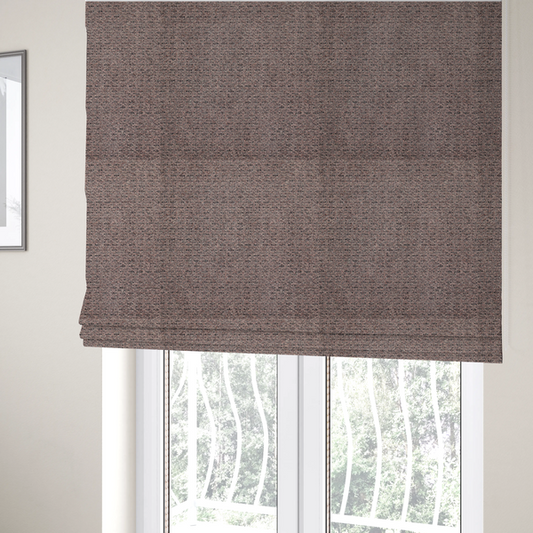 The fabric used to create these Roman blinds is a purple textured upholstery fabric.