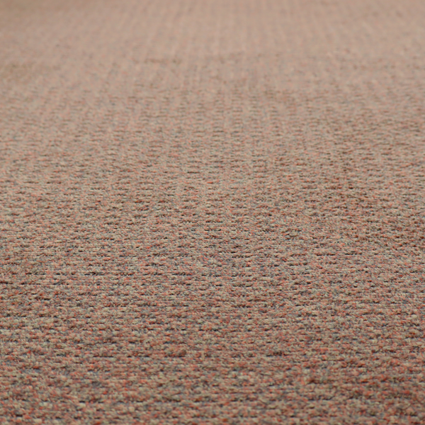 A multi-toned orange and grey textured upholstery fabric.