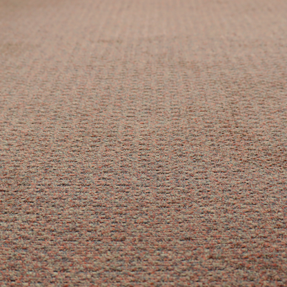A multi-toned orange and grey textured upholstery fabric.