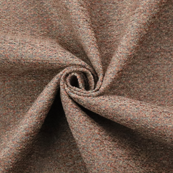 A multi-toned orange and grey textured upholstery fabric.