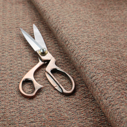 A multi-toned orange and grey textured upholstery fabric.