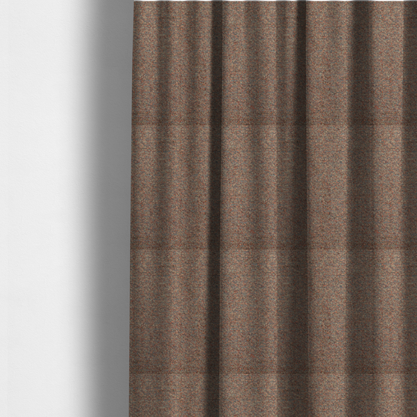 The fabric used to create these made-to-measure curtains is a multi-toned orange and grey textured upholstery fabric.