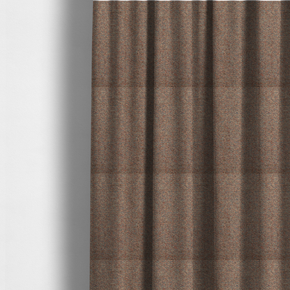 The fabric used to create these made-to-measure curtains is a multi-toned orange and grey textured upholstery fabric.