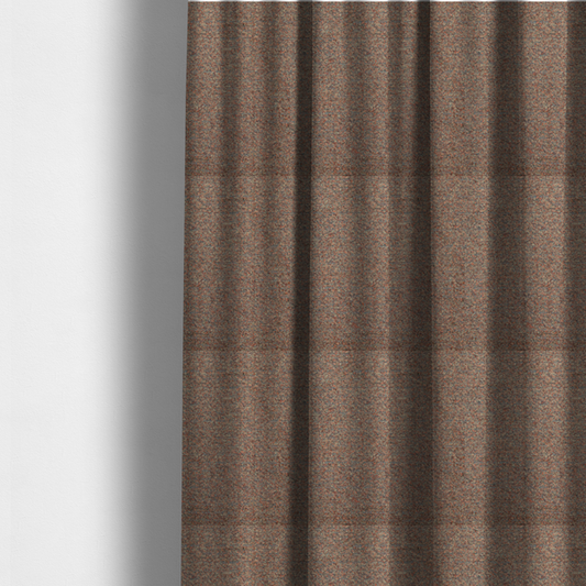 The fabric used to create these made-to-measure curtains is a multi-toned orange and grey textured upholstery fabric.