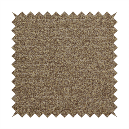 A multi-toned golden brown, textured upholstery fabric.